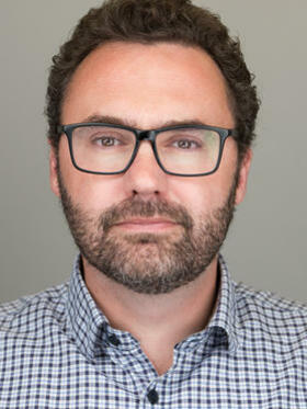 Headshot of Dr Adam Roberts
